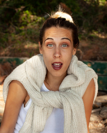 young pretty woman posing emotional outside, lifestyle people conceptの写真素材