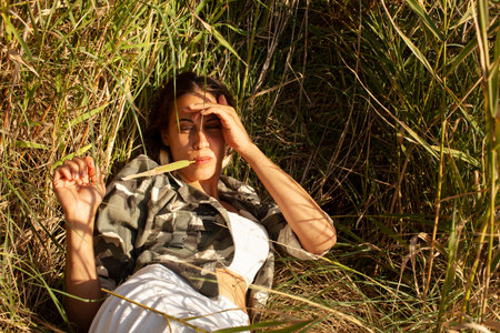 young pretty woman posing emotional outside, lifestyle people conceptの写真素材