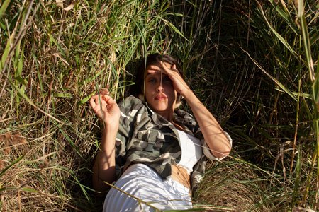 young pretty woman posing emotional outside, lifestyle people conceptの写真素材
