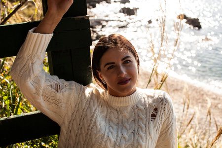 young brunette woman on sea coast, lifestyle people conceptの写真素材