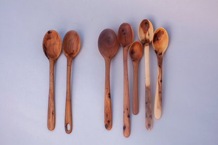 Wooden kitchen utensils stacked view isolatedの写真素材