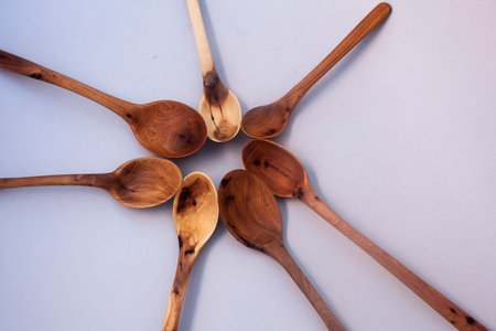 Wooden kitchen utensils stacked view isolatedの写真素材