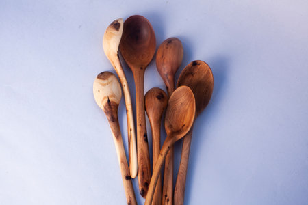 Wooden kitchen utensils stacked view isolatedの写真素材
