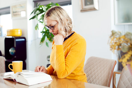 an adult woman working in home interior, lifestyle people conceptの写真素材