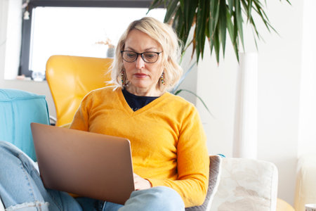 an adult woman working in home interior, lifestyle people conceptの写真素材