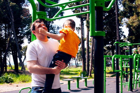 father with little son on the playground, lifestyle people concept