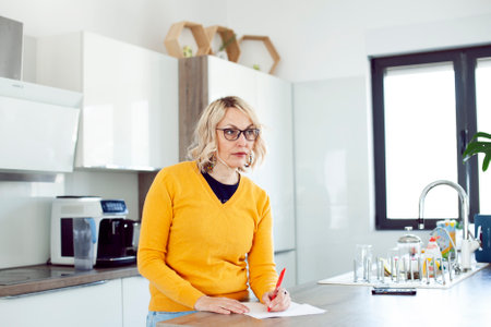 an adult woman working in home interior, lifestyle people conceptの写真素材