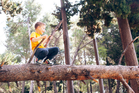 little cute boy climbing on tree, lifestyle people concept