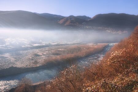 Landscape view of A beautiful scene of misty mountains