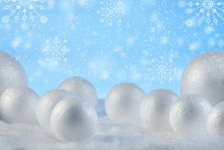 Christmas composition with decorative snowballs against holiday lights background