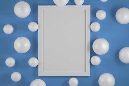 Christmas or New year holiday composition. picture frame and Christmas balls on fashion background....