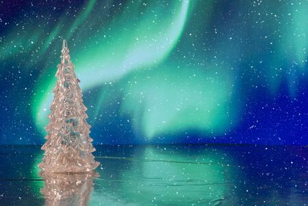 Beautiful Christmas composition with Christmas tree against holiday lights backgroundの写真素材