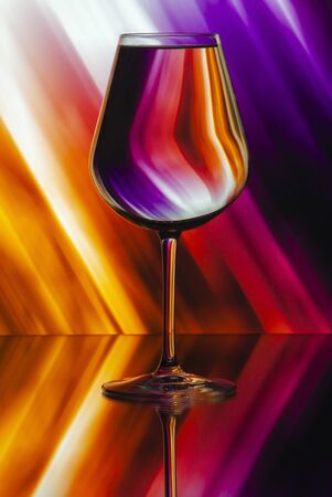 Pattern distortions seen through a glass of water. Still life