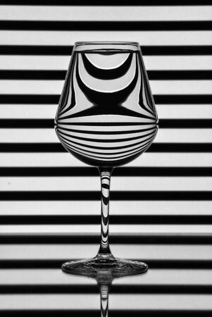 Pattern distortions seen through a glass of water. Still lifeの写真素材