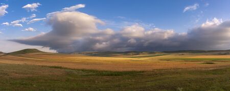 Colorful autumn fields and beautiful clouds. Georgia. Kakheti regionの写真素材