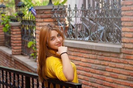 Beautyful teen girl on the street of old European city. Travelの写真素材
