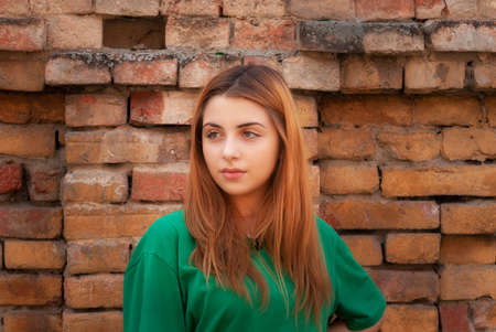Close up portrait of a beautiful teenage girl with Phone posing in the city Street