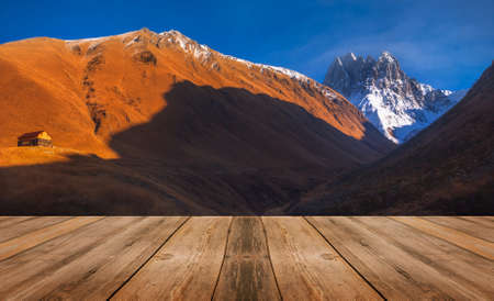 Autumn sunset landscape, with empty wooden table, nature outdoor.の写真素材