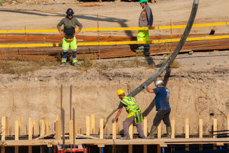 Georgia, Tbilisi - October 27, 2020: The process of building a house. Construction builders. Worker construction process.のeditorial素材