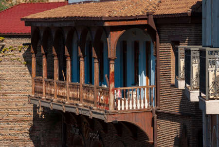 Georgia, Tbilisi - October 23, 2020: Houses with balconies in the historic district of Tbilisi. Georgia. Evening View. Beautiful Old town at sunset.のeditorial素材