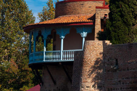 Georgia, Tbilisi - October 23, 2020: Houses with balconies in the historic district of Tbilisi. Georgia. Evening View. Beautiful Old town at sunset.のeditorial素材