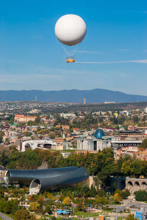 Georgia, Tbilisi - October 23, 2020: Air excursion balloon over Tbilisi, Capital of Georgia.のeditorial素材