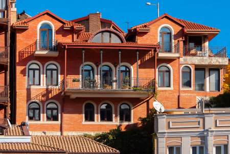 Georgia, Tbilisi - November 22, 2020: Houses with balconies in the historic district of Tbilisi. Georgia. Evening View. Beautiful Old town at sunset.のeditorial素材