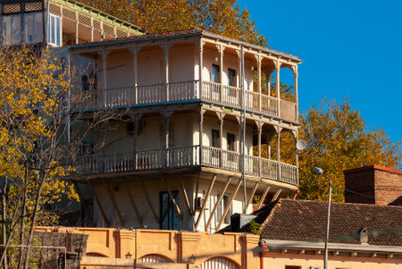 Georgia, Tbilisi - November 22, 2020: Houses with balconies in the historic district of Tbilisi. Georgia. Evening View. Beautiful Old town at sunset.のeditorial素材