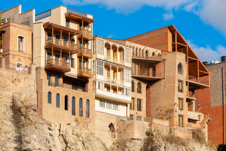Georgia, Tbilisi - November 27, 2020: Houses with balconies in the historic district of Tbilisi. Georgia. Evening View. Beautiful Old town at sunset.のeditorial素材