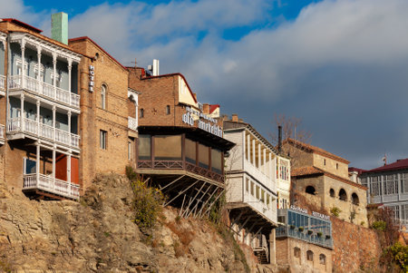 Georgia, Tbilisi - November 27, 2020: Houses with balconies in the historic district of Tbilisi. Georgia. Evening View. Beautiful Old town at sunset.のeditorial素材