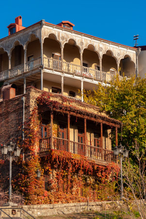 Georgia, Tbilisi - November 28, 2020: Houses with balconies in the historic district of Tbilisi. Georgia. Evening View. Beautiful Old town at sunset.のeditorial素材