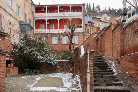 Georgia, Tbilisi - February 25, 2021: Houses with balconies in the historic district of Tbilisi. Georgia. Winter View. Beautiful Old town.のeditorial素材
