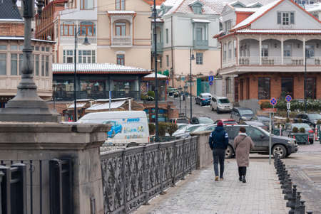 Georgia, Tbilisi - February 25, 2021: People walk in the city.のeditorial素材