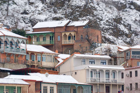 Georgia, Tbilisi - February 25, 2021: Houses with balconies in the historic district of Tbilisi....