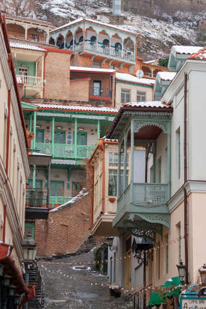 Georgia, Tbilisi - February 25, 2021: Houses with balconies in the historic district of Tbilisi. Georgia. Winter View. Beautiful Old town.のeditorial素材