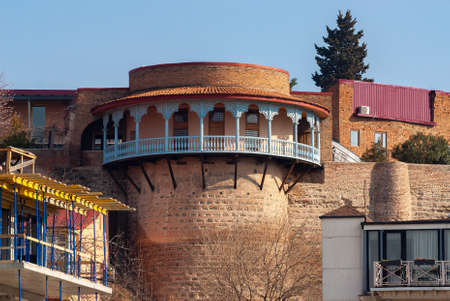 Georgia, Tbilisi - March 17, 2021: Houses with balconies in the historic district of Tbilisi....