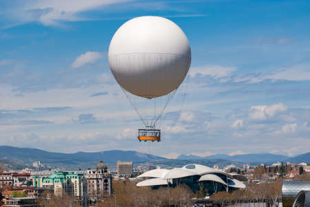Georgia, Tbilisi - April 15, 2021: Air excursion balloon over Tbilisi, Capital of Georgia.