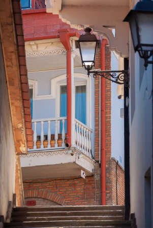 Georgia, Tbilisi - April 15, 2021: Houses with balconies in the historic district of Tbilisi. Georgia. Evening View. Beautiful Old town at sunset.のeditorial素材