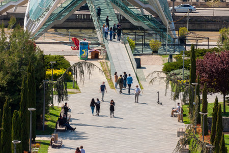 Georgia, Tbilisi - April 15, 2021: People walk in the city park.