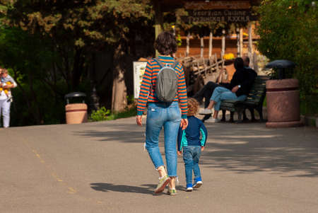 Georgia, Tbilisi - May 8, 2021: People walk in the city park.のeditorial素材