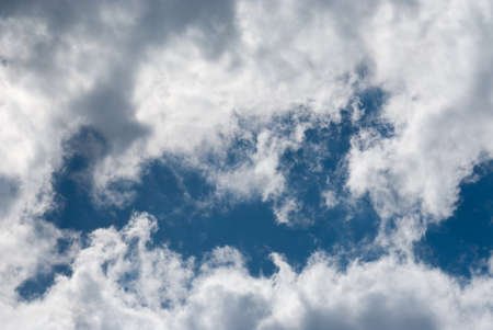 Blue sky background with clouds. Natural background.