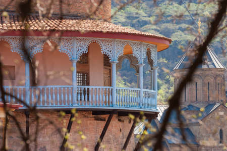 Georgia, Tbilisi - April 15, 2021: Houses with balconies in the historic district of Tbilisi. Georgia. Evening View. Beautiful Old town at sunset.のeditorial素材