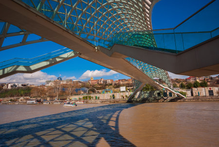 Georgia, Tbilisi - April 15, 2020: Bridge of Peace over the Kura River in Tbilisi, Georgia.
