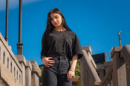 Beautiful teen girl on the street of old European city. Travel.