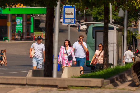 Georgia, Tbilisi - September 17, 2022: Tourists walking on busy city street.のeditorial素材