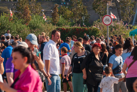 Georgia, Tbilisi - October 2, 2022: Group of anonymous People in City Park