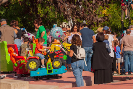 Georgia, Tbilisi - October 2, 2022: Group of anonymous People in City Parkのeditorial素材
