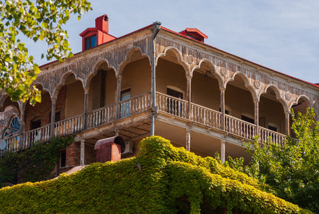 Georgia, Tbilisi - September 17, 2022: Houses with balconies in the historic district of Tbilisi. Georgia. evening view. Beautiful old town at sunset.のeditorial素材