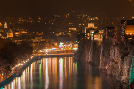 Georgia, Tbilisi - December 30, 2021: Panoramic view of the old town at night.のeditorial素材