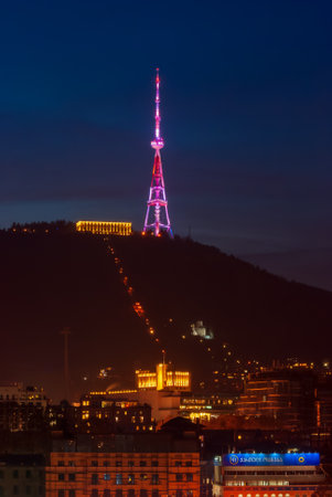 Georgia, Tbilisi - December 30, 2021: TV Broadcasting Tower on Mtatsminda Hill in Tbilisi, Georgia at night.のeditorial素材
